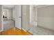 Hallway with hardwood floors leading to multiple rooms at 1370 Alberta Dr, Winter Park, FL 32789