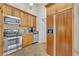 Kitchen features stainless steel appliances, rich wood cabinetry, and lots of counter space at 1370 Alberta Dr, Winter Park, FL 32789