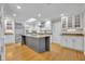 Spacious kitchen featuring an island, stainless steel appliances, and modern cabinetry at 1370 Alberta Dr, Winter Park, FL 32789