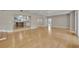 Open room showcasing hardwood floors, natural light, and direct access to the kitchen at 1370 Alberta Dr, Winter Park, FL 32789