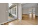 Bright living room with hardwood floors, natural light, and a serene garden view at 1370 Alberta Dr, Winter Park, FL 32789