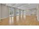 Spacious living area featuring hardwood floors, vaulted ceilings, and pool views at 1370 Alberta Dr, Winter Park, FL 32789