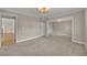 Spacious living room with neutral carpet, crown molding, and natural light at 1370 Alberta Dr, Winter Park, FL 32789