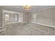 Inviting living room featuring neutral carpet and access to a bathroom at 1370 Alberta Dr, Winter Park, FL 32789