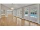 Hardwood floors, large french doors with pool views, and a modern light fixture at 1370 Alberta Dr, Winter Park, FL 32789
