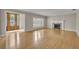 Spacious living room boasts hardwood floors, fireplace, and detailed glass front doors at 1370 Alberta Dr, Winter Park, FL 32789