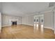 Open living area with hardwood floors, fireplace, and doors to a private pool area at 1370 Alberta Dr, Winter Park, FL 32789