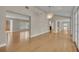 Spacious room with hardwood floors, natural light, open layout, and vaulted ceilings at 1370 Alberta Dr, Winter Park, FL 32789