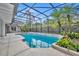 Relaxing screened-in pool with tropical landscaping creates a serene outdoor living space at 1370 Alberta Dr, Winter Park, FL 32789