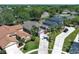 Aerial view of a suburban home with mature trees and inviting curb appeal at 14021 King Sago Ct, Orlando, FL 32828