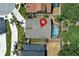 Aerial view of a home with screened-in pool and well-maintained landscaping at 14021 King Sago Ct, Orlando, FL 32828