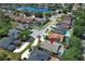 Aerial view of a quiet suburban neighborhood, featuring a beautiful lake at 14021 King Sago Ct, Orlando, FL 32828