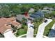 Aerial view of a suburban home with mature trees and inviting curb appeal at 14021 King Sago Ct, Orlando, FL 32828
