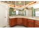 Bathroom with a large vanity featuring double sinks, a walk-in shower, and decorative wallpaper at 14021 King Sago Ct, Orlando, FL 32828