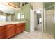 Bathroom featuring a large vanity with ample counter space and a walk-in shower at 14021 King Sago Ct, Orlando, FL 32828