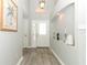 Bright foyer showcasing wood-look floors, high ceilings, and decorative wall niche at 14021 King Sago Ct, Orlando, FL 32828