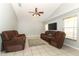Spacious living room with tile floors, ceiling fan and comfortable seating for relaxing and entertaining guests at 14021 King Sago Ct, Orlando, FL 32828
