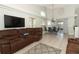Open-concept living room and dining area with sliding door access to backyard that brings in natural light at 14021 King Sago Ct, Orlando, FL 32828
