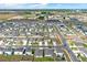 Wide aerial shot of a residential community with tidy streets, sidewalks, and well-maintained landscaping at 1511 Finnigan Cir, Haines City, FL 33844