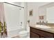 Bathroom featuring a shower-tub, vanity with sink, framed mirror and decorative accents at 1511 Finnigan Cir, Haines City, FL 33844
