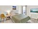 This cozy bedroom features a large window, wall art, and a desk at 1511 Finnigan Cir, Haines City, FL 33844
