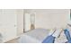 This bedroom features neutral walls, a closet, and a door into another room at 1511 Finnigan Cir, Haines City, FL 33844