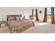 This bedroom features two large windows, curtains, and a cozy chair at 1511 Finnigan Cir, Haines City, FL 33844