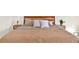 The primary bedroom is furnished with two nightstands, a large bed, and neutral decor at 1511 Finnigan Cir, Haines City, FL 33844
