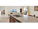 Features an island with bar stool seating, an undermount sink, and an open floorplan at 1511 Finnigan Cir, Haines City, FL 33844