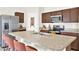 Modern kitchen with stainless steel appliances, large island with bar seating, and ample counter space at 1511 Finnigan Cir, Haines City, FL 33844