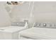 Well-lit laundry room featuring a modern washer and dryer, plus convenient overhead shelving at 1511 Finnigan Cir, Haines City, FL 33844
