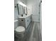 Bathroom with double vanity, modern fixtures, and light gray flooring at 15282 Sw 65Th Avenue Rd, Ocala, FL 34473
