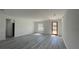 Spacious room featuring gray wood-look flooring and natural light; ready for personalization at 15282 Sw 65Th Avenue Rd, Ocala, FL 34473