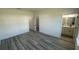 Bright bedroom with gray flooring, ample light, and access to a full bathroom at 15282 Sw 65Th Avenue Rd, Ocala, FL 34473