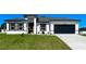 Beautiful single-story home with a well-maintained lawn, stylish front door, and an attached garage at 15282 Sw 65Th Avenue Rd, Ocala, FL 34473