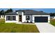 Charming single-story home featuring a modern design, attached garage, and fresh landscaping at 15282 Sw 65Th Avenue Rd, Ocala, FL 34473