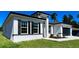 Elegant single-story home showcasing modern architectural elements, landscaping, and an attached garage at 15282 Sw 65Th Avenue Rd, Ocala, FL 34473