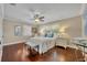 Bright bedroom with hardwood floors, a ceiling fan, and a sunny window at 1633 Pine Ave, Winter Park, FL 32789