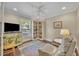 Cozy bedroom with hardwood floors, natural light, and built-in bookcase with a quiet spot to read and unwind at 1633 Pine Ave, Winter Park, FL 32789