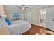 Bedroom featuring hardwood floors and access to a well-lit bathroom at 1633 Pine Ave, Winter Park, FL 32789