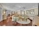 Bright living room features hardwood floors, a comfortable sectional sofa, and views of the kitchen at 1633 Pine Ave, Winter Park, FL 32789