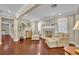 Comfortable living room featuring a fireplace, hardwood floors, and neutral paint colors, ideal for relaxation at 1633 Pine Ave, Winter Park, FL 32789