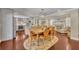 Inviting dining area flowing into a bright living room with hardwood floors, fireplace, and ample seating at 1633 Pine Ave, Winter Park, FL 32789