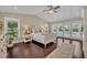 Main bedroom with vaulted ceilings, hardwood floors, and pool view through sliding glass doors at 1633 Pine Ave, Winter Park, FL 32789