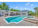 Inviting pool and spa area with brick pavers and an outdoor living space, perfect for relaxation and entertaining at 1633 Pine Ave, Winter Park, FL 32789