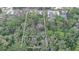 A captivating aerial view showcasing the expansive lot and lush greenery at 1845 Spruce Creek Blvd at 1845 Spruce Creek Blvd, Port Orange, FL 32128