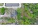 Aerial view of residences with a densely vegetated area, showing rooftops at 1845 Spruce Creek Blvd, Port Orange, FL 32128