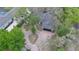 Aerial shot of a home showing the driveway and mature landscaping at 1845 Spruce Creek Blvd, Port Orange, FL 32128