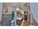 Nicely renovated bathroom with toilet and sink with stylish tiling and vanity at 1845 Spruce Creek Blvd, Port Orange, FL 32128
