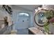 Modern bathroom with white wavy tiling, a skylight, and a shower at 1845 Spruce Creek Blvd, Port Orange, FL 32128